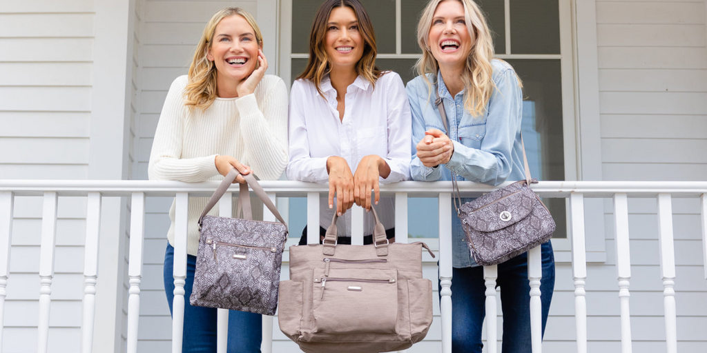 3 Female Models Holding Baggallini Bags
