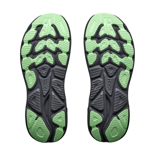 Green and black sole of a shoe on a white background