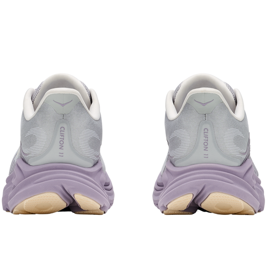 Pair of gray and purple running shoes on a white background