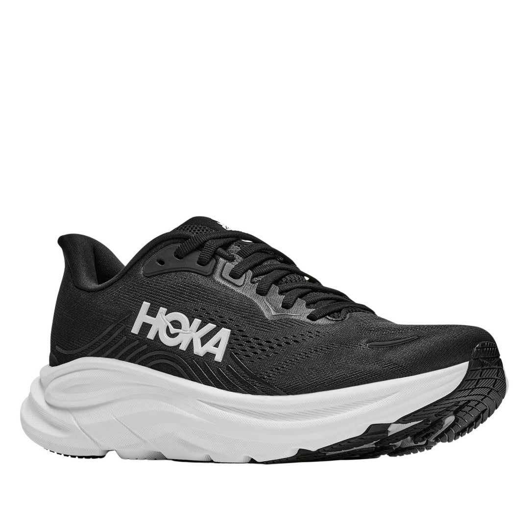 Black running shoe with white sole on a white background