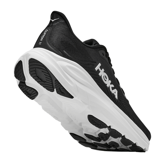 Black and white running shoe with 'Hoka' branding on a white background