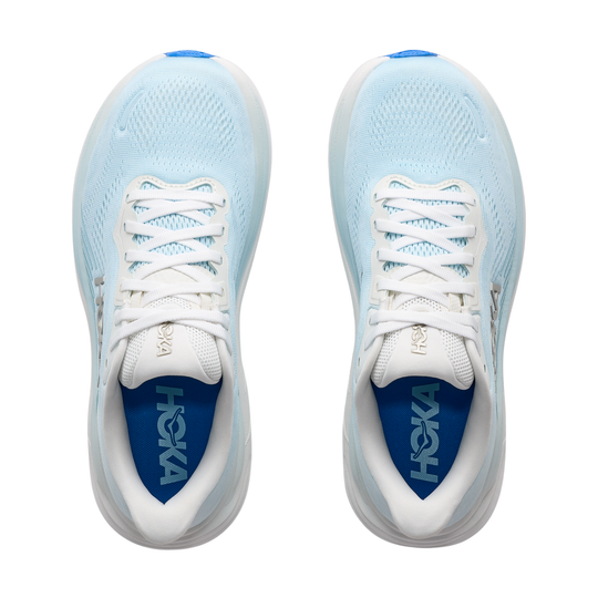 Light blue running shoes with white laces on a white background