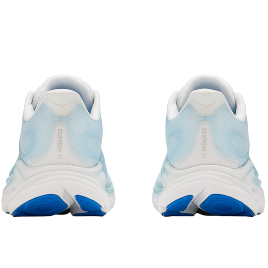 Pair of light blue and white running shoes with blue soles on a white background