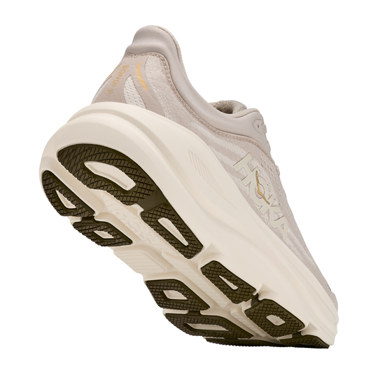 White running shoe with a thick sole on a white background