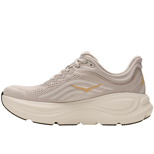 Beige running shoe with a brand logo on a white background
