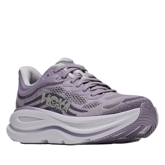Purple running shoe with white sole on a white background