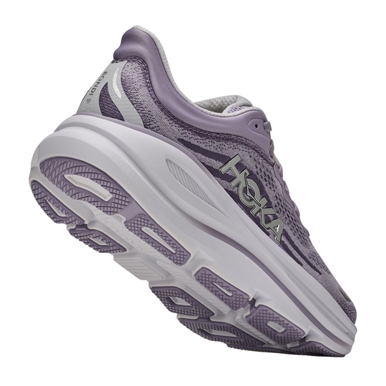 Purple running shoe with white sole on a white background