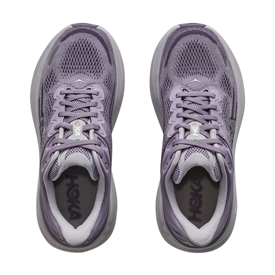 Pair of purple running shoes with 'Hoka' branding on a white background
