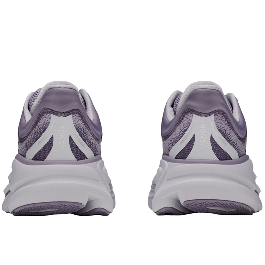 Pair of purple and white running shoes on a white background