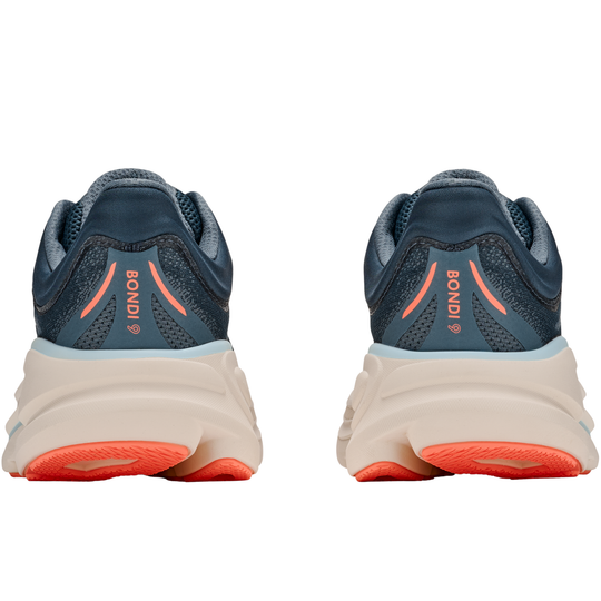 Pair of blue running shoes with orange accents on a white background