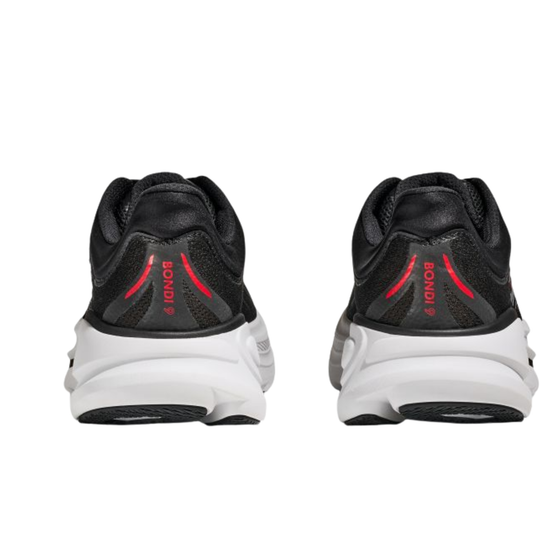 Black and white athletic shoes with red accents on a white background