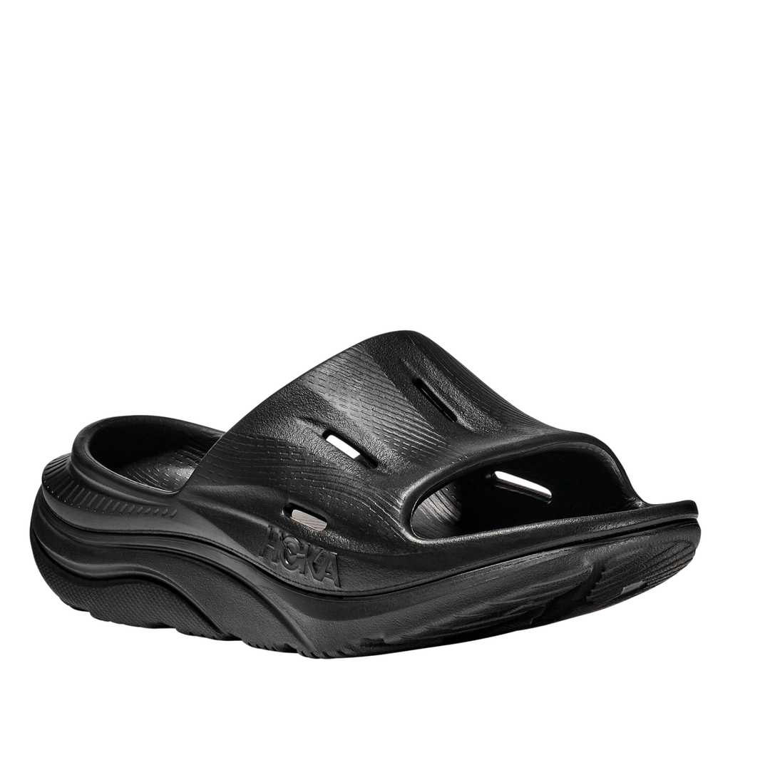 Black sandal with 'Hoka' branding on a white background