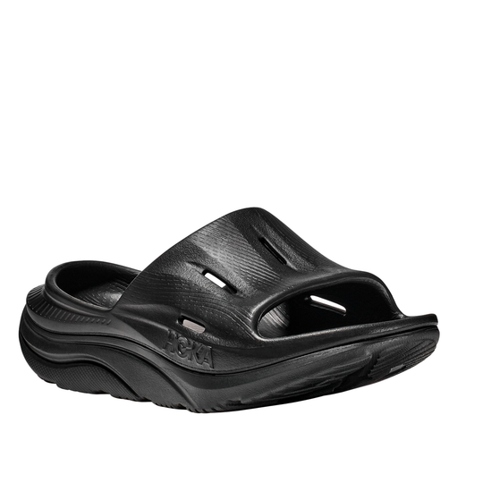 Black sandal with 'Hoka' branding on a white background