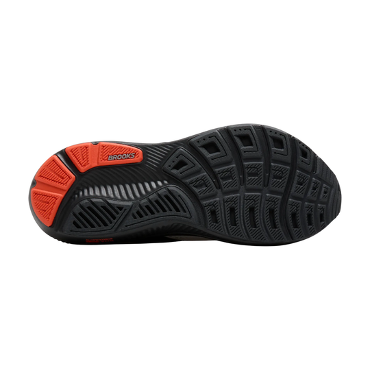 Running shoe with black and red sole on a white background