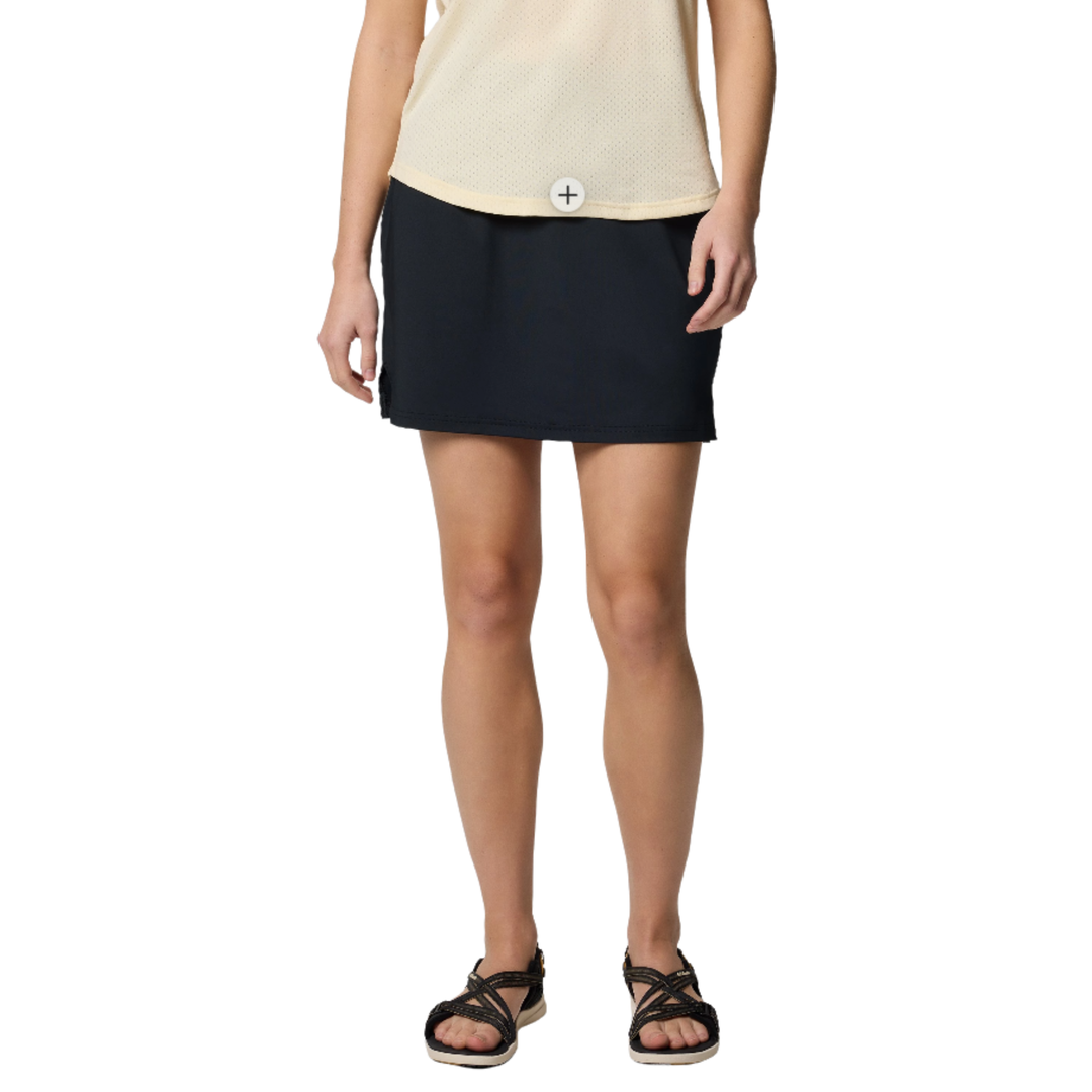 Person wearing a black skirt on a white background