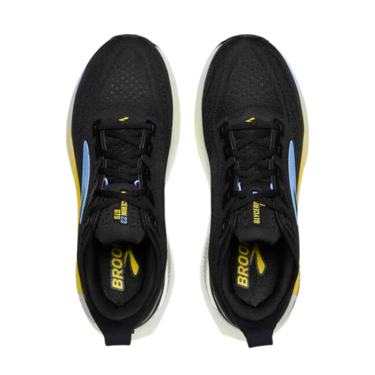 Black running shoes with yellow accents on a white background