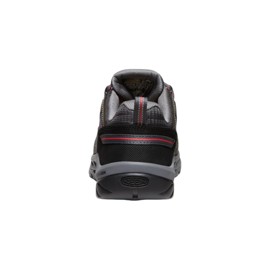 Black and gray shoe with red accents on a white background