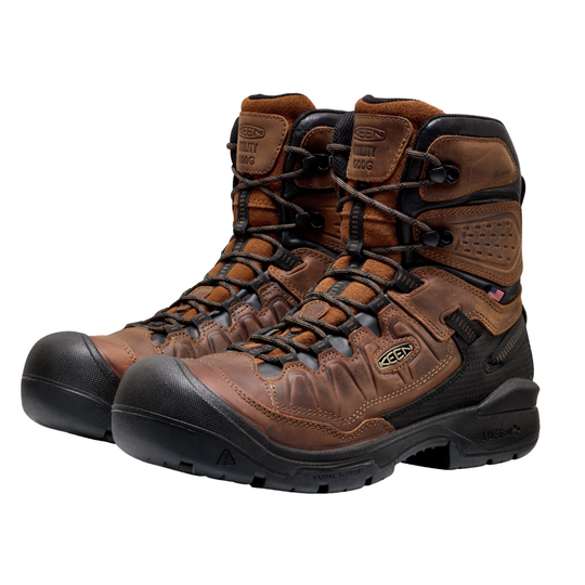 Pair of brown work boots with black soles on a white background