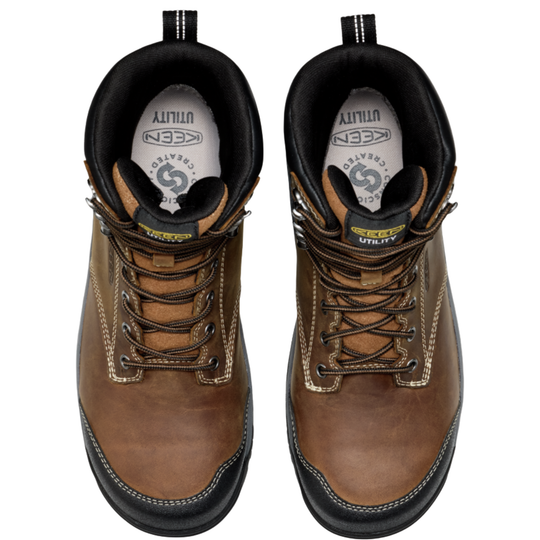 Pair of brown work boots with visible brand logo on a white background