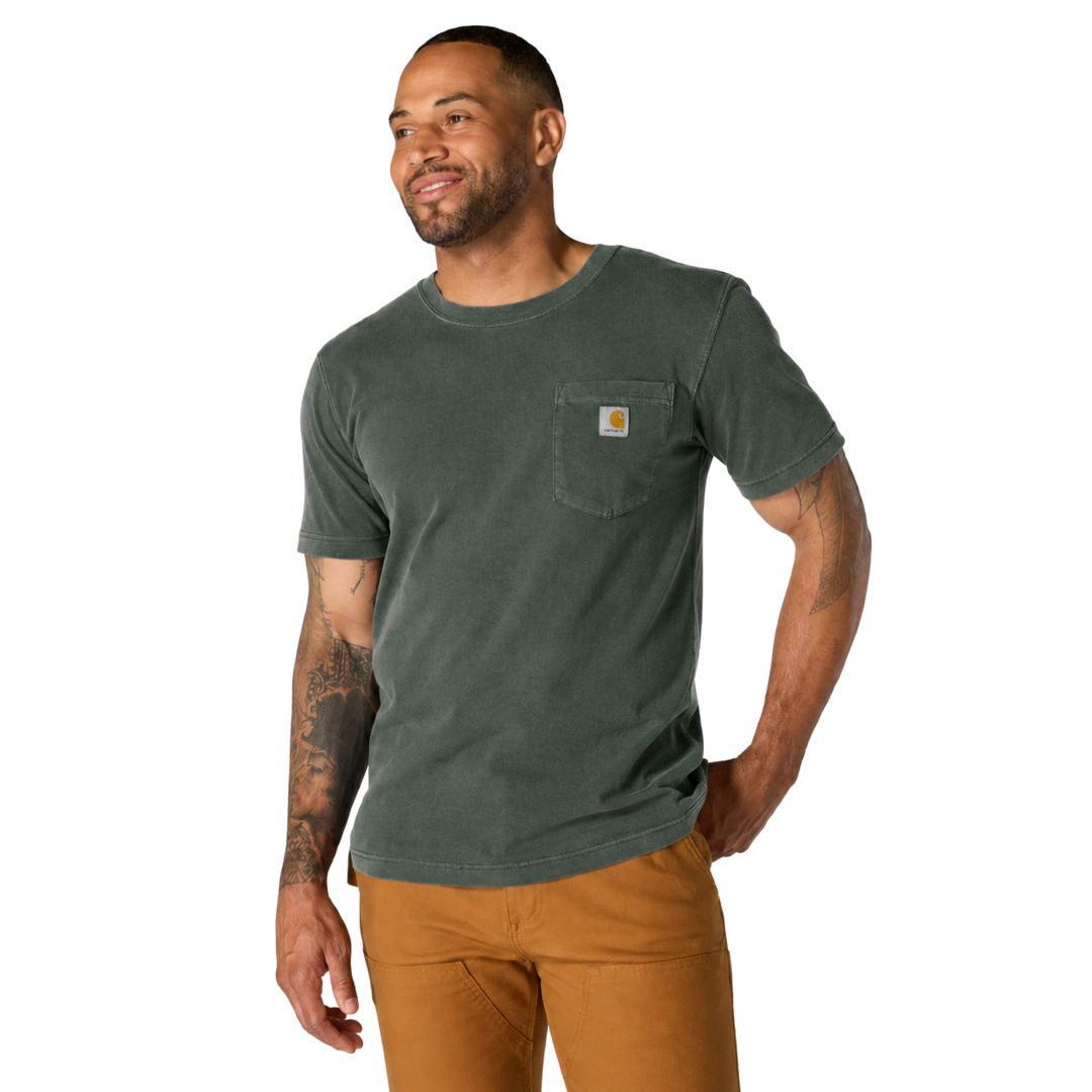 Man wearing a green t-shirt and brown pants on a white background