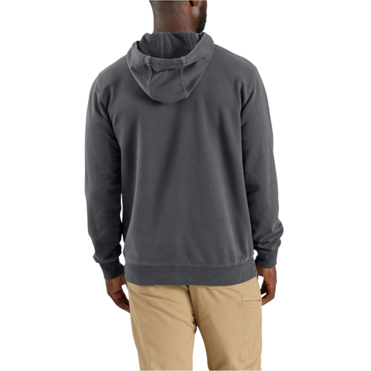 Person wearing a gray hoodie and beige pants on a white background
