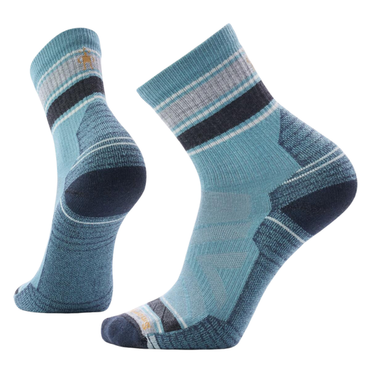 Pair of blue socks with striped pattern on a white background