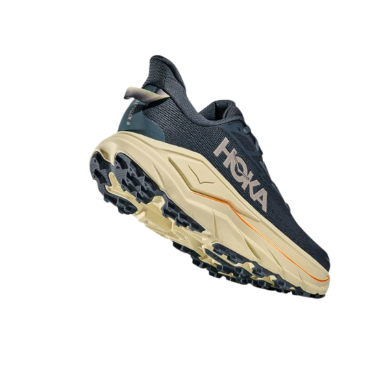 Navy and beige running shoe with 'Hoka' branding on a white background