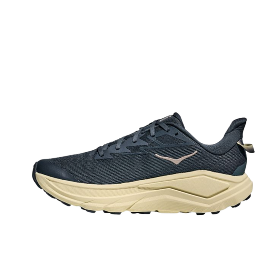 Navy running shoe with beige sole on a white background