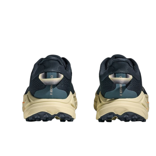 Pair of navy and beige sneakers on a white background