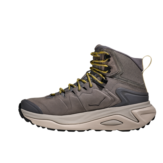Gray hiking boot with beige sole on a white background