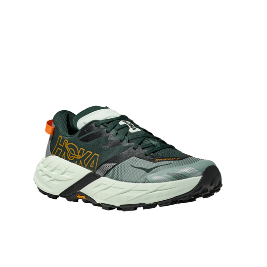 Green and gray running shoe with white sole on a white background