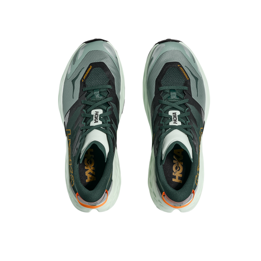 Pair of gray running shoes with orange accents on a white background