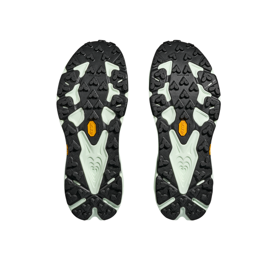 Close-up of black and gray shoe soles with brand logo on a white background