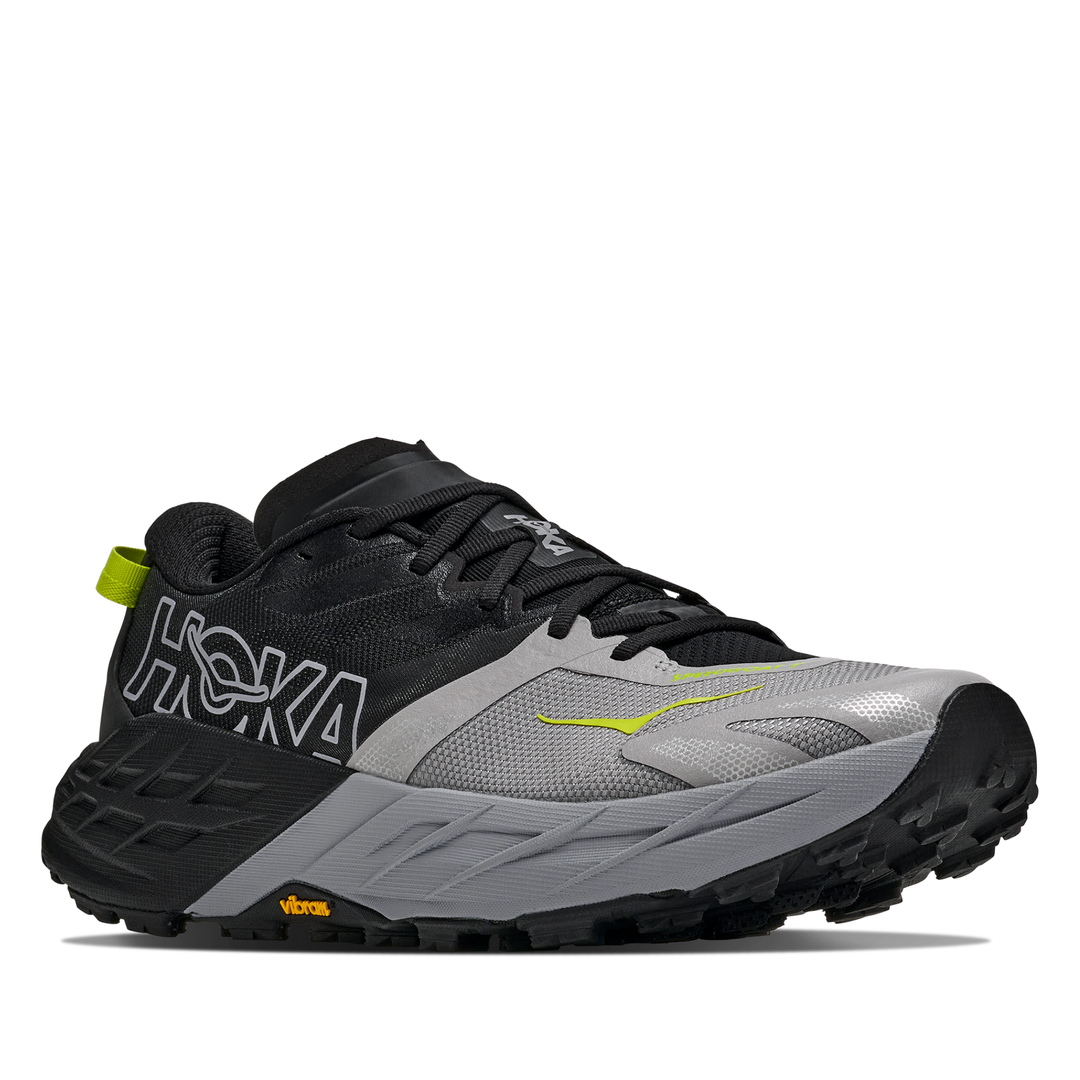 Black and gray running shoe with visible Hoka branding on a white background