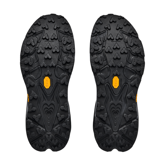 Black shoe sole with orange accents on a white background