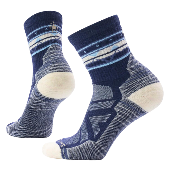 Pair of blue and white patterned socks on a white background