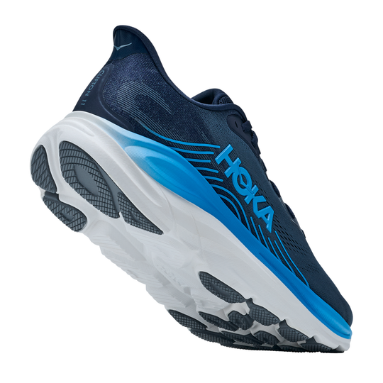 Blue and black running shoe with white sole on a white background