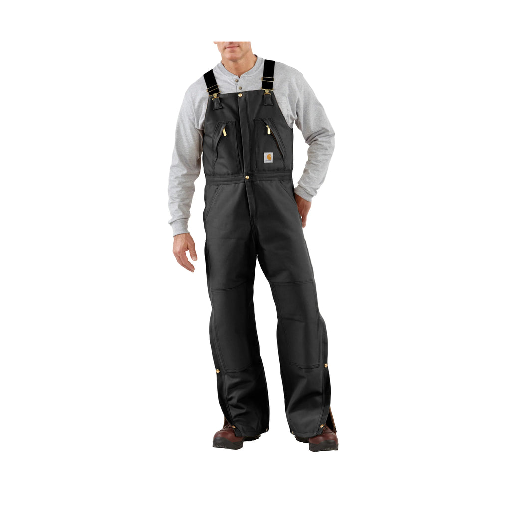 Person wearing black bib overalls on a white background