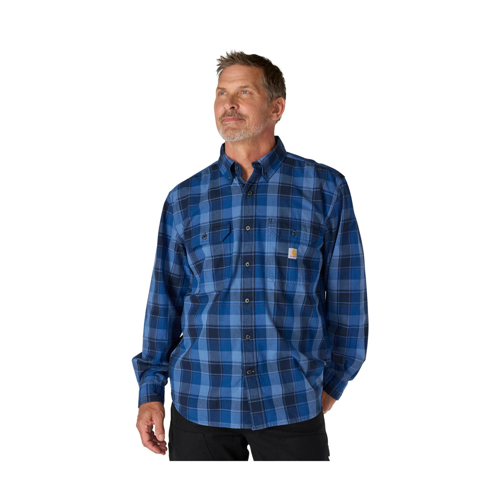Man wearing a blue plaid shirt on a white background