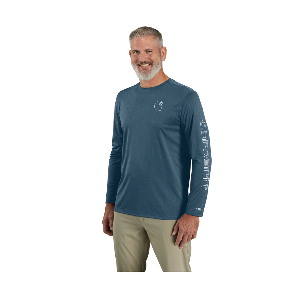 Man wearing a blue long-sleeve shirt with a logo on a white background