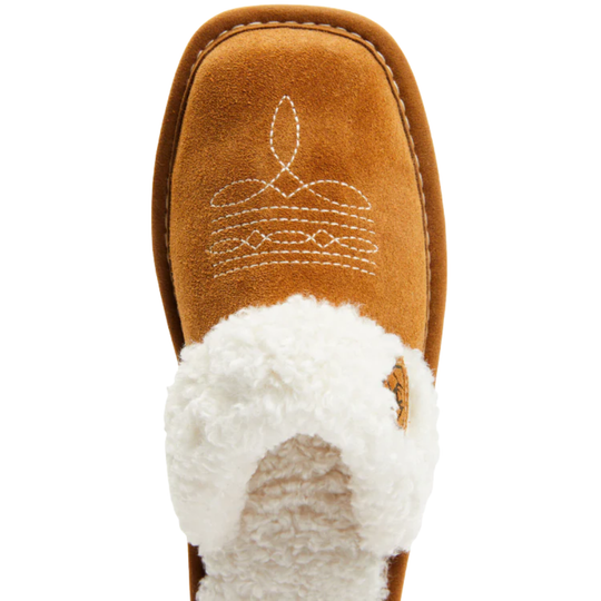 A single tan suede slipper boot with white sherpa lining and white decorative stitching on the upper, shown against a plain white background.