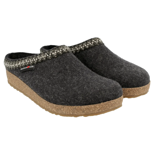 Pair of dark gray slippers with cork sole on a white background