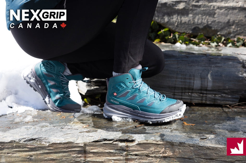 Person wearing blue hiking boots with NEXGRIP Canada branding on a snowy ground.