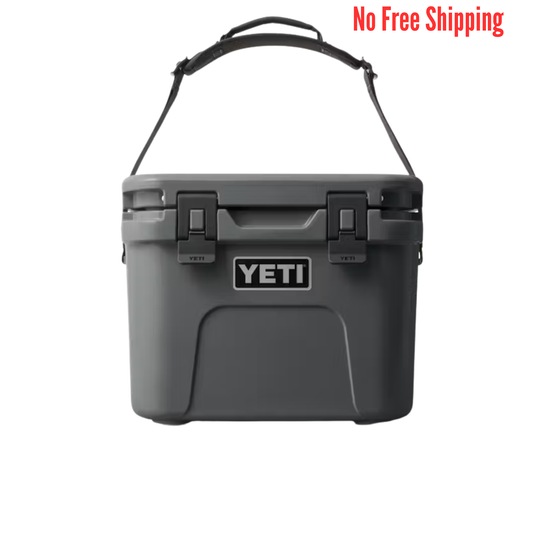 Gray YETI cooler with a black handle on a white background