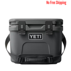 Gray YETI cooler with black handles on a white background