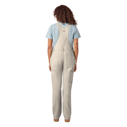 Dickies Women's Double Front Bib Overalls - Rinsed Stone on a female model on a white background