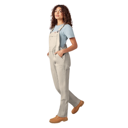 Dickies Women's Double Front Bib Overalls - Rinsed Stone on a female model on a white background