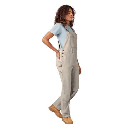 Dickies Women's Double Front Bib Overalls - Rinsed Stone on a female model on a white background