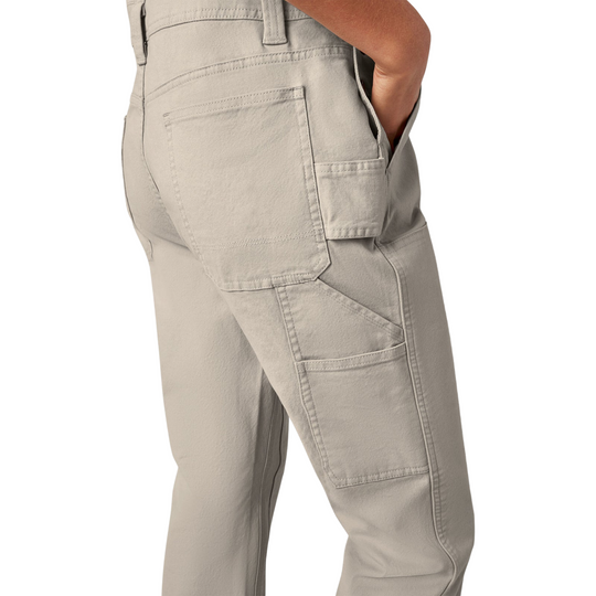 Dickies Women's Double Front Bib Overalls - Rinsed Stone on a female model on a white background.