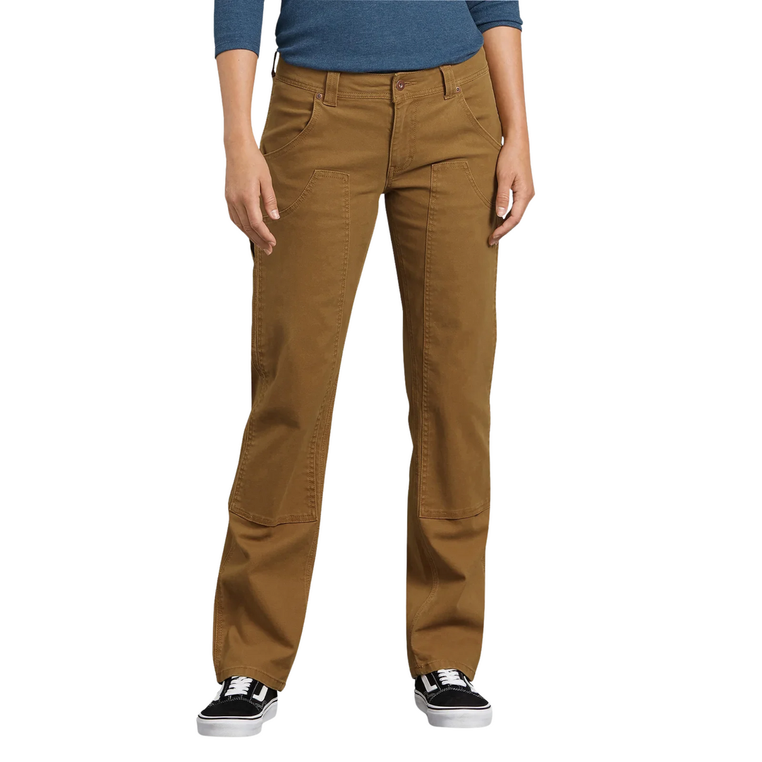 Dickies Women's Flex Relaxed Fit Duck Carpenter Pants - Rinsed Brown Duck on a female model on a white background.